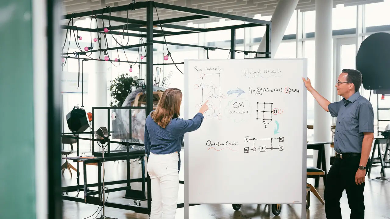 Two Bosch Research experts discussing their research work at our research campus in Renningen, Germany